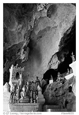 Novice Buddhist monk in  Tham Ting cave,  Pak Ou. Laos (black and white)