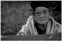Older woman wears a mix of tribal and western garb. Luang Prabang, Laos (black and white)