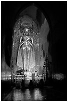 One of four monumental statues inside Ananda pahto. Bagan, Myanmar (black and white)