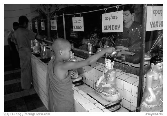 Novice offering Water at  Mahamuni Paya. Mandalay, Myanmar (black and white)