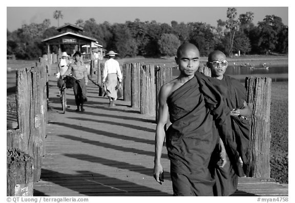 On the two century old U Bein bridge, Amarapura. Mandalay, Myanmar