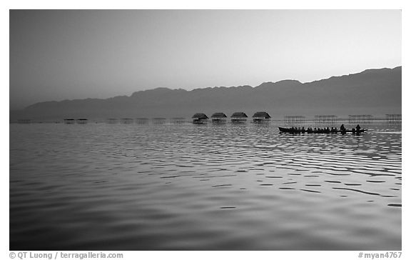 Long boat,  stilts huts, and mountains, sunrise. Inle Lake, Myanmar (black and white)