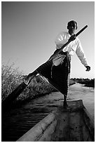Intha man demonstrating leg-rowing. Inle Lake, Myanmar ( black and white)