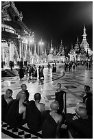 Monks, Terrace and Naungdawgyi (Elder Brother) Pagoda at night, Shwedagon Pagoda. Yangon, Myanmar ( black and white)