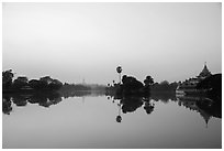 Royal Lake with Shwedagon Pagoda and Karawek barge. Yangon, Myanmar ( black and white)