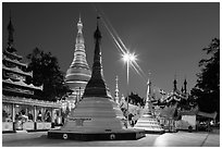 Shrines, stupas, and Main Stupa at dawn, Shwedagon Pagoda. Yangon, Myanmar ( black and white)