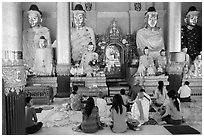 Praying at a Devotion Hall. Yangon, Myanmar ( black and white)