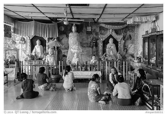 Visitors and altar, Botataung Pagoda. Yangon, Myanmar (black and white)