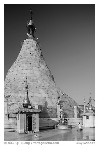 Man praying outside Botataung Pagoda main stupa. Yangon, Myanmar (black and white)