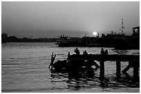 Diving into the Yangon River at sunset. Yangon, Myanmar ( black and white)