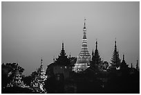Distant view of Naungdawgyi Pagoda and shrines at dawn. Yangon, Myanmar ( black and white)