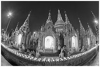 Oil lamps and stupas at dusk, Shwedagon Pagoda. Yangon, Myanmar ( black and white)