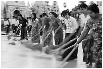 Row of women sweeping, Shwedagon Pagoda. Yangon, Myanmar ( black and white)