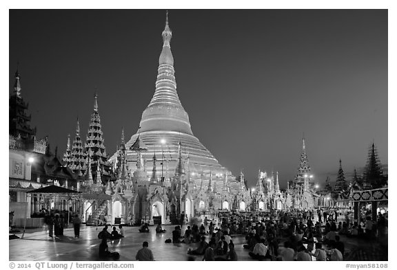Praying from the Victory Ground, Shwedagon Pagoda, dusk. Yangon, Myanmar (black and white)
