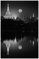 Full Moon setting over Shwedagon Pagoda and Kandawgyi Lake. Yangon, Myanmar ( black and white)