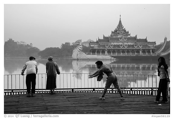 People exercising in front of Karawiek Hall. Yangon, Myanmar (black and white)