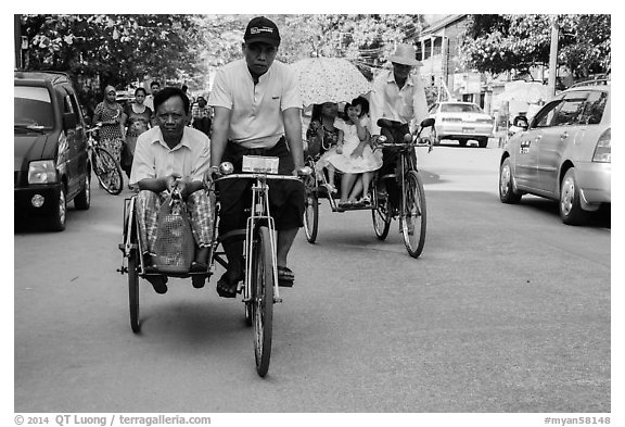 Trishaws on street. Yangon, Myanmar (black and white)