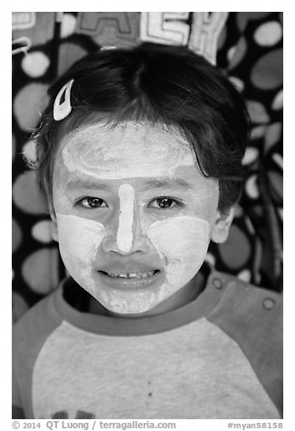 Infant with face covered in thanaka paste. Bagan, Myanmar (black and white)