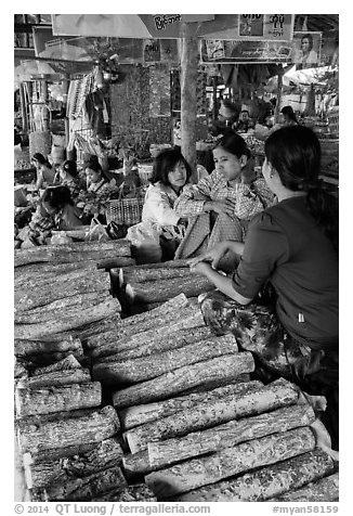 Women selling wood ground to make thanaka. Bagan, Myanmar (black and white)