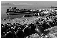 Unloading jars on the Ayeyarwaddy River. Bagan, Myanmar ( black and white)