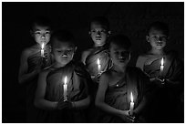 Young buddhist novices holding candles. Bagan, Myanmar ( black and white)