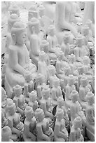 Unfinished white marble buddha statues of various sizes. Mandalay, Myanmar ( black and white)