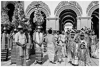 Young children and families gathering for noviciation ceremony, Mahamuni Pagoda. Mandalay, Myanmar ( black and white)