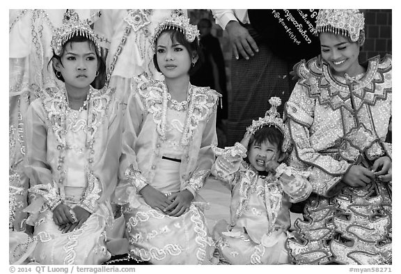 Girls with make-up and princely attire reacting during Noviciation, Mahamuni Pagoda. Mandalay, Myanmar (black and white)
