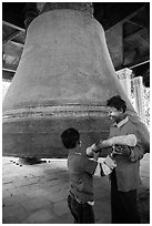 Children ring the huge Mingun bell, Mingun. Myanmar ( black and white)