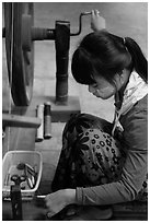 Woman assembling a yarn package. Amarapura, Myanmar ( black and white)