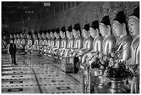 Buddha images in crescent-shaped hall, U Min Thonze pagoda, Sagaing. Myanmar ( black and white)
