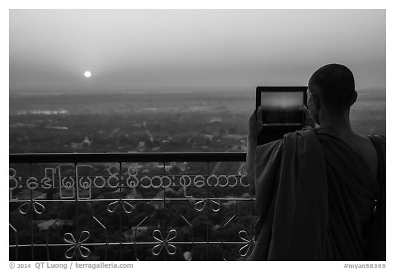 Monk taking picture of sunset from Sagaing Hill. Myanmar (black and white)
