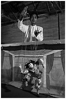 Puppeter handling traditional burmese string marionette. Mandalay, Myanmar ( black and white)