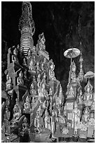 Many buddha images surround main stupa in Pindaya Caves. Pindaya, Myanmar ( black and white)