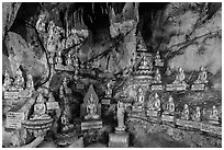 Some of 8,000 buddha images in Pindaya Caves. Pindaya, Myanmar ( black and white)