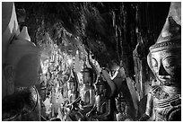 Buddha statues and stalactites in Pindaya Caves. Pindaya, Myanmar ( black and white)