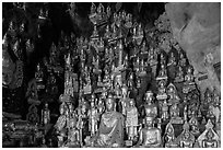 Buddha statues of all sizes near entrance of Pindaya Caves. Pindaya, Myanmar ( black and white)