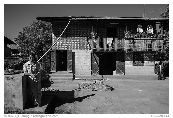 Woman in front of house. Pindaya, Myanmar (black and white)