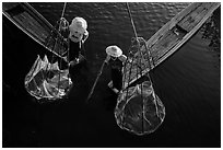 Intha fishermen with conical baskets seen from above. Inle Lake, Myanmar ( black and white)