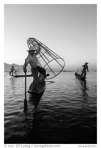Group of Intha fishermen at dawn. Inle Lake, Myanmar (black and white)