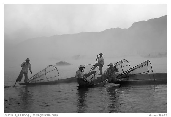 Intha fishermen gathering in dawn mist. Inle Lake, Myanmar (black and white)
