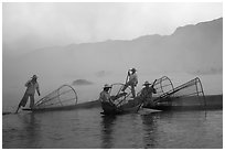 Intha fishermen gathering in dawn mist. Inle Lake, Myanmar ( black and white)