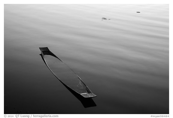 Sunken canoe and ripples. Inle Lake, Myanmar (black and white)