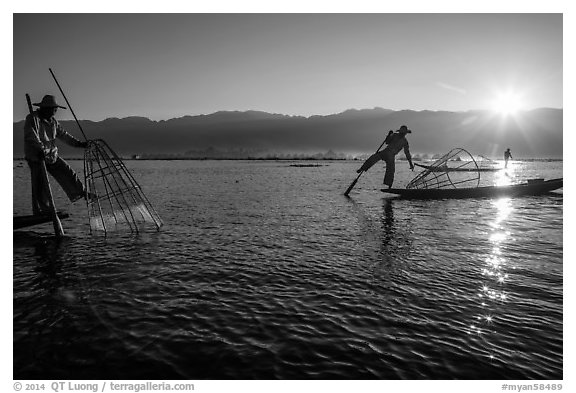 Intha fishermen and sun. Inle Lake, Myanmar (black and white)