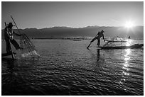 Intha fishermen and sun. Inle Lake, Myanmar ( black and white)