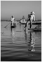 Intha fishermen and reflections. Inle Lake, Myanmar ( black and white)