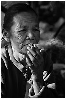 Woman smoking cheerot cigar. Inle Lake, Myanmar ( black and white)