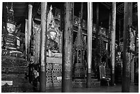 Old wood sculptures inside Nga Phe Kyaung monastery. Inle Lake, Myanmar ( black and white)