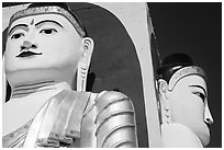 Detail of two of the four seated buddhas in  Kyaik Pun Paya. Bago, Myanmar ( black and white)