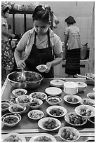 Cooks serving Burmese food. Bago, Myanmar ( black and white)